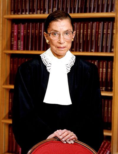Image of Ruth Bader Ginsberg with her trademark white collar and black supreme court justice robes.