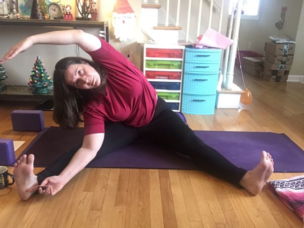 seated hand to toe pose