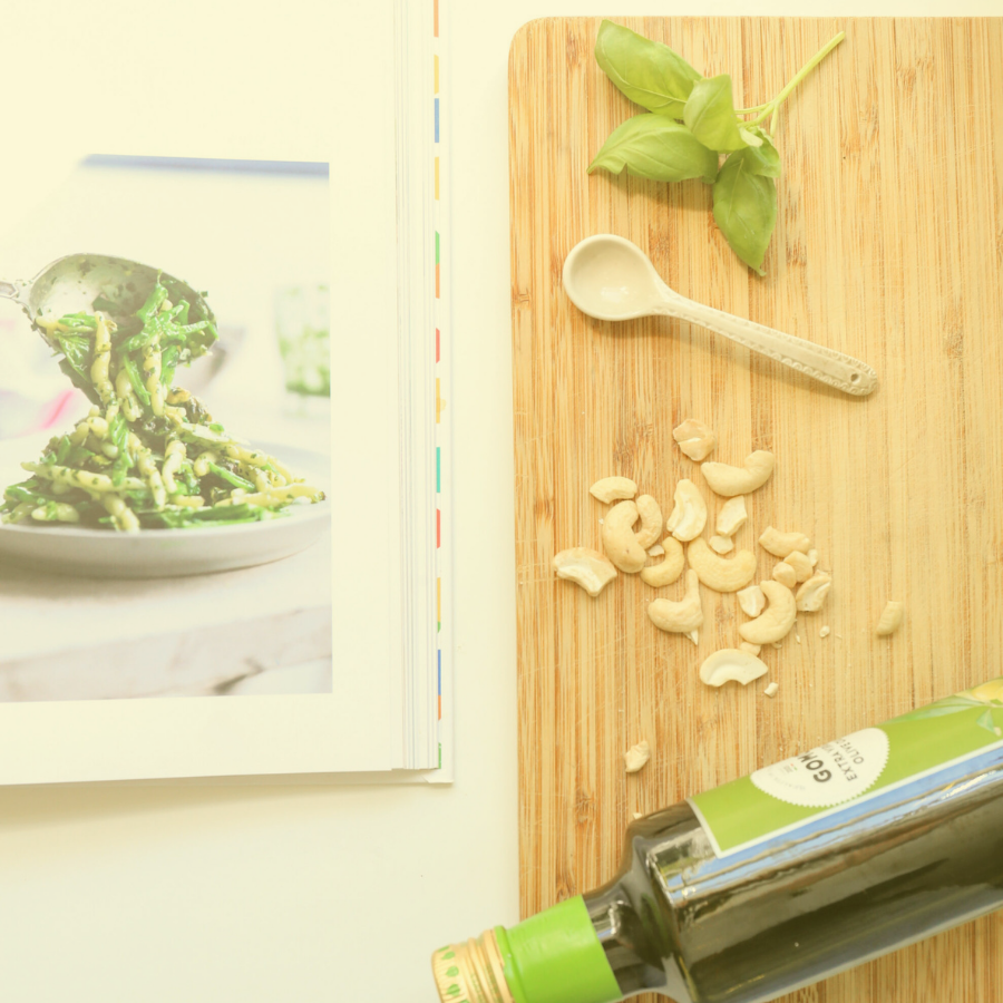 cookbook beside a cutting board