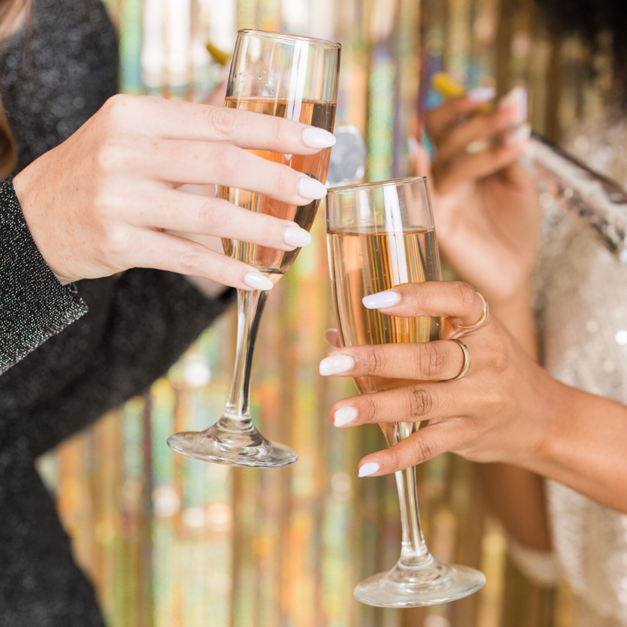 two people clinking champagne glasses