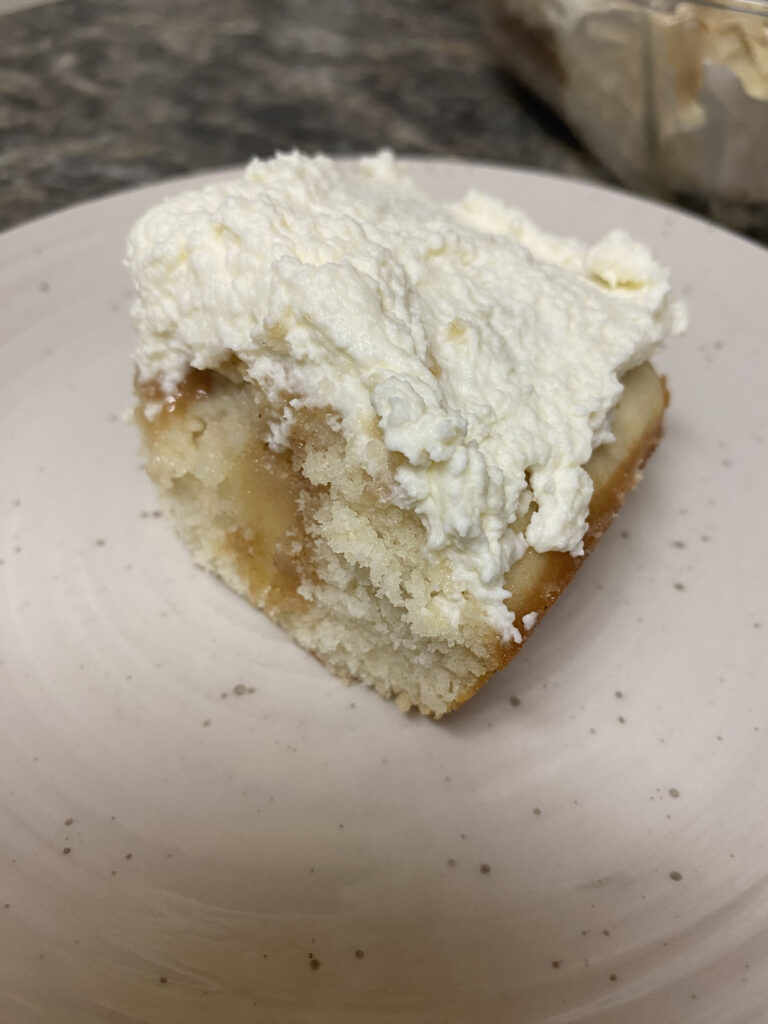 close up shot of cardamom caramel poke cake slice