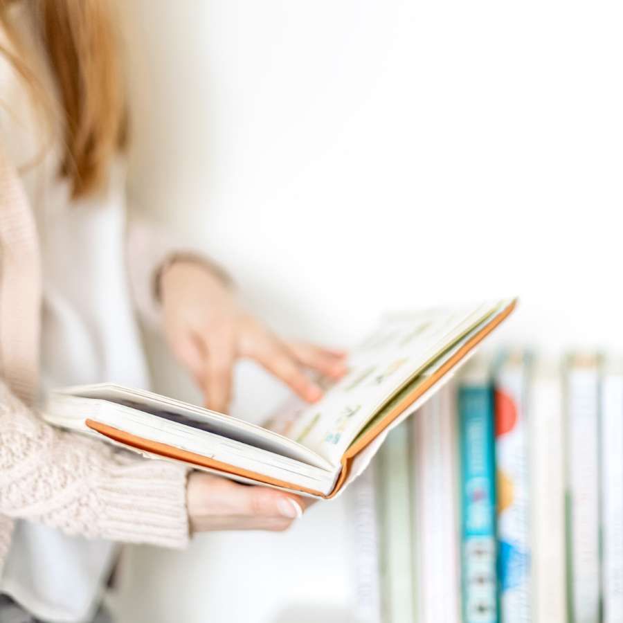 book stack for holidays alone