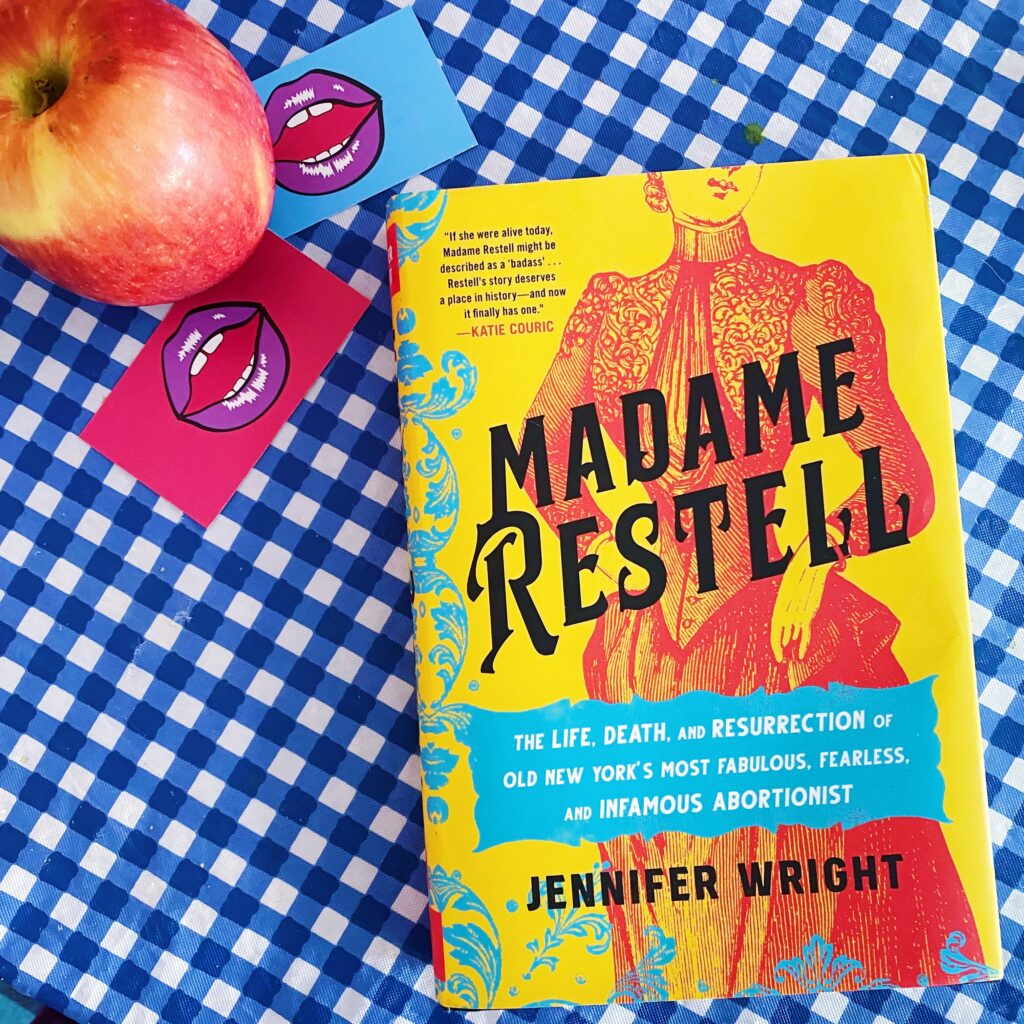 Madame Restell by Jennifer Wright on blue gingham table cloth