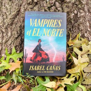 the book Vampires of El Norte by Isabel Canas with a fall background