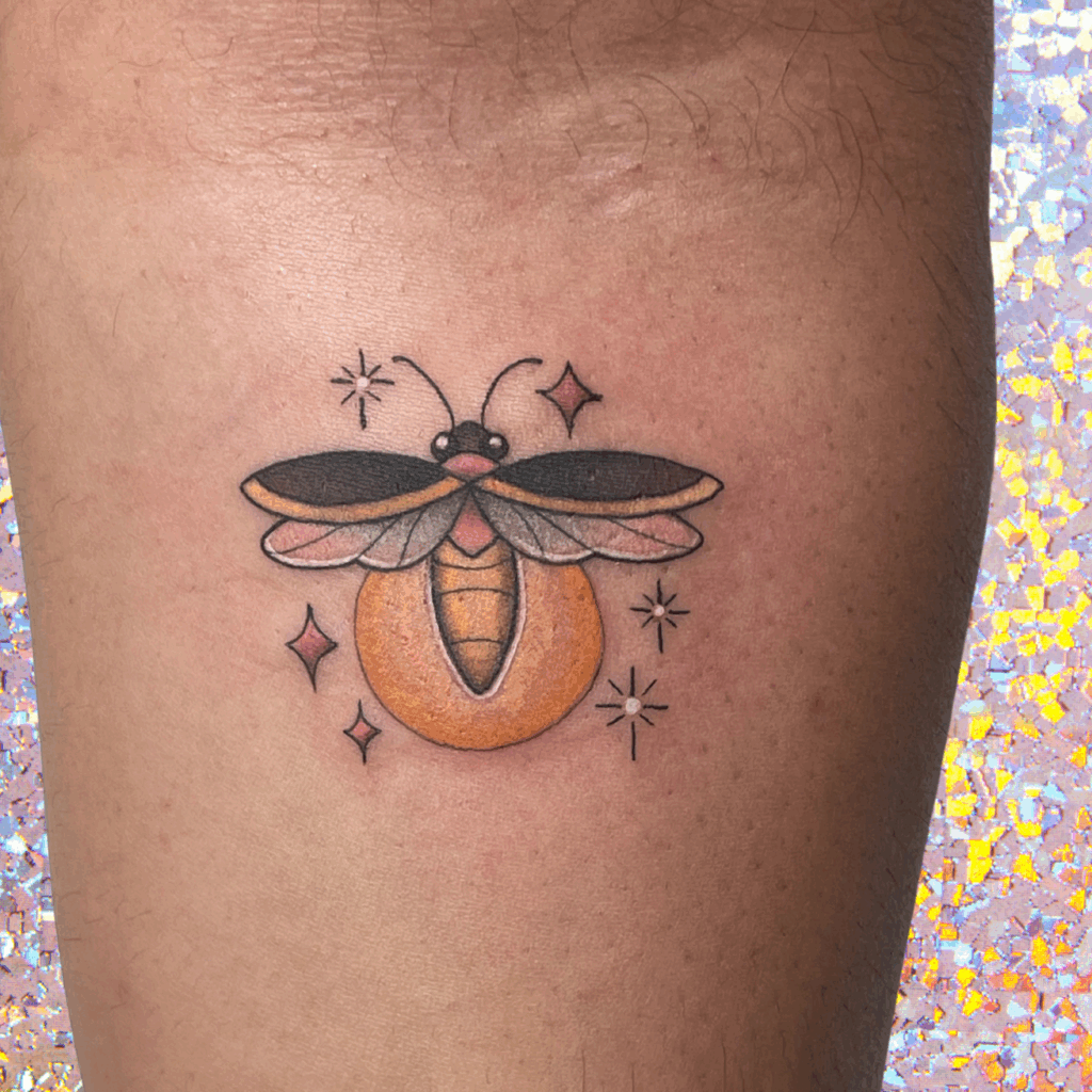 picture of a firefly tattoo on a glitter background because project 2025 aims to take away my joy and I won't let it