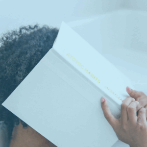 featured image for Mental Healrth Awareness Is Not Enough - woman covering face with book